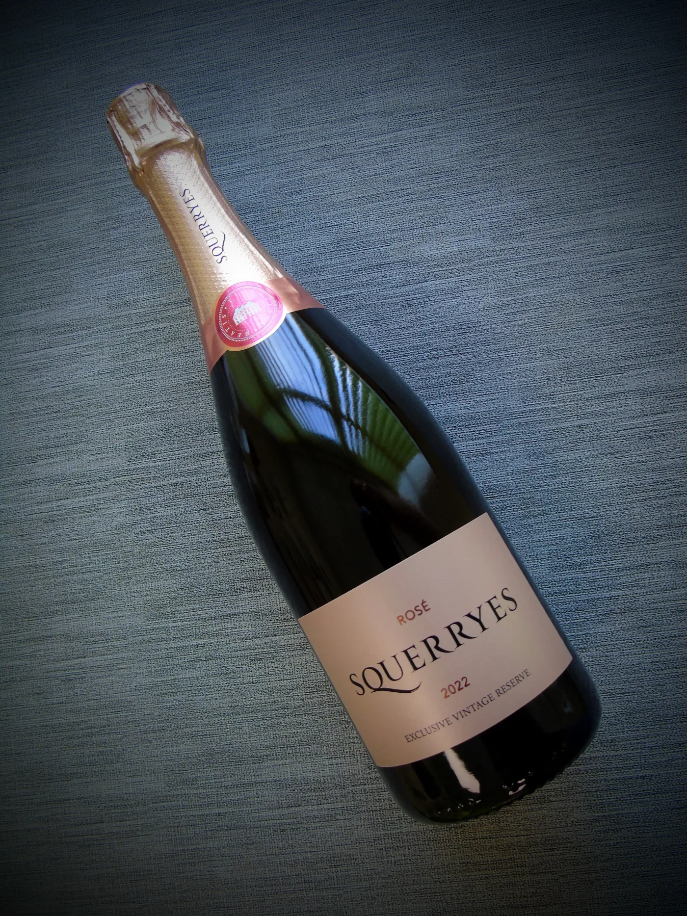 Custom wine label on Squerryes Rosé Magnum designed for chilled environments with tactile finishes and premium detailing